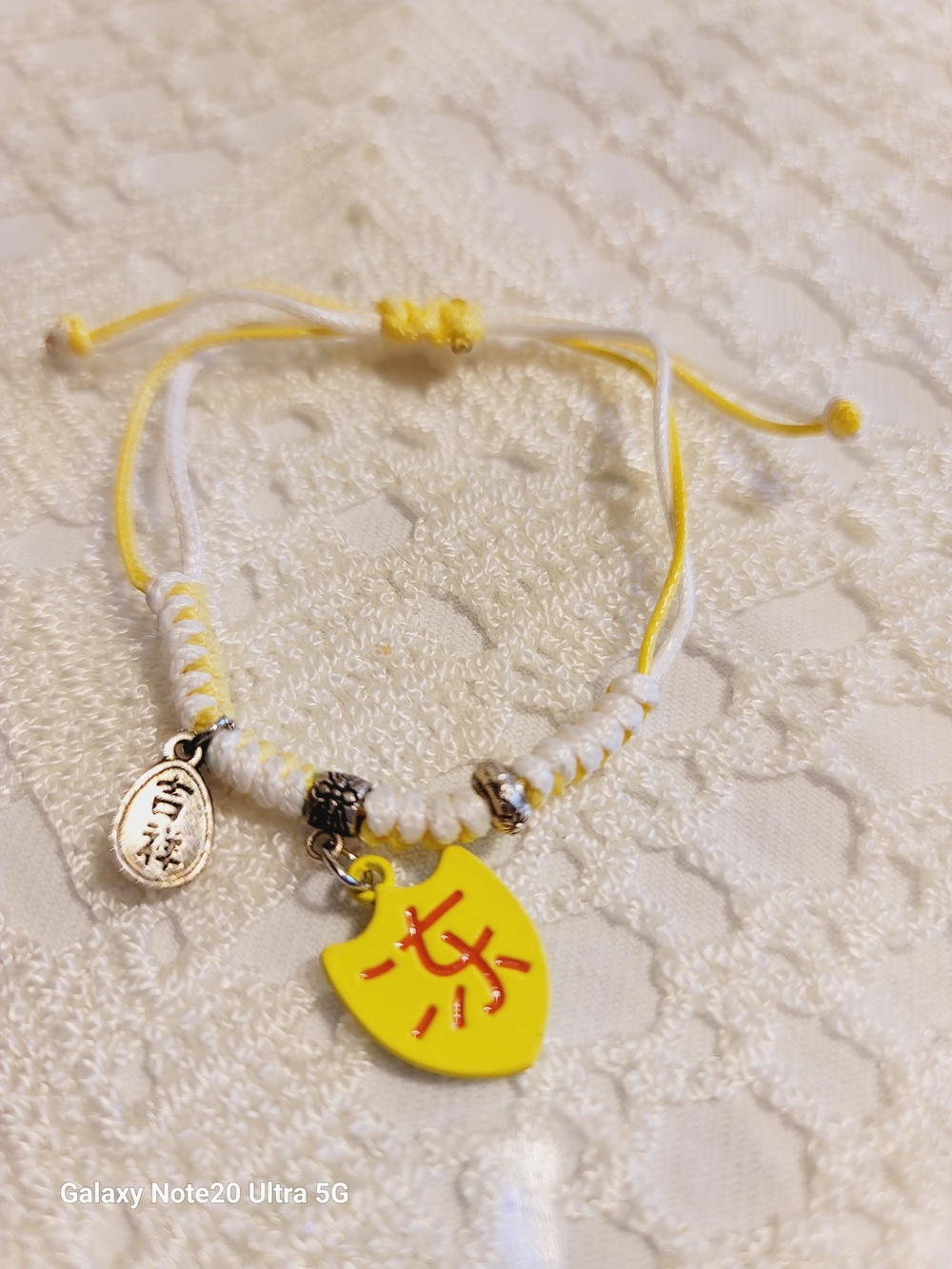 Yellow and White Charm Bracelet with Yellow Shield Charm